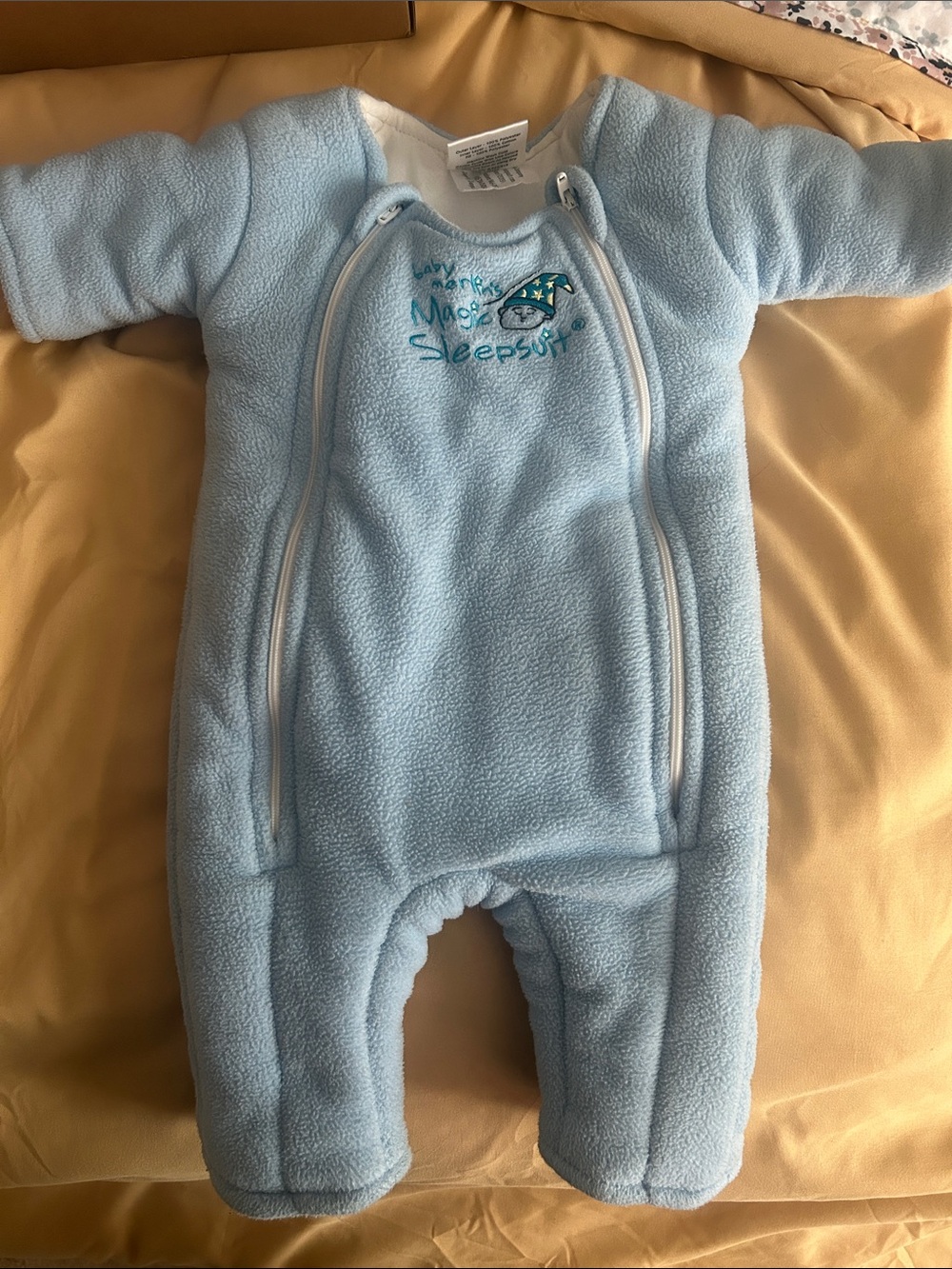 Baby Merlin size 3-6months small 12-18lbs.  Baby Merlin’s magic sleepsuit blue